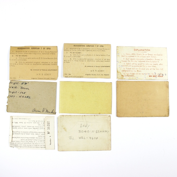 Interesting grouping of insignia, dog tags, ID documents, photos,…