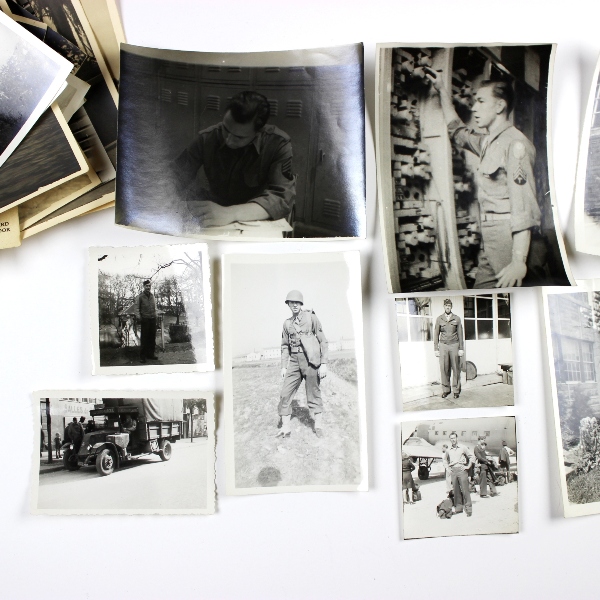 Interesting grouping of insignia, dog tags, ID documents, photos,…