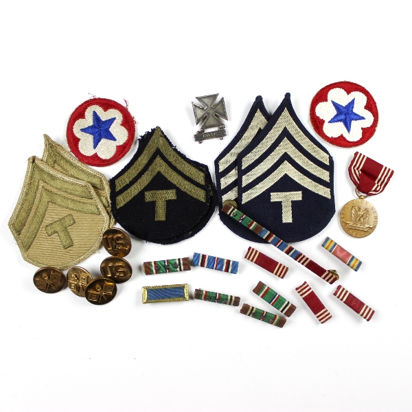 Interesting grouping of insignia, dog tags, ID documents, photos,…