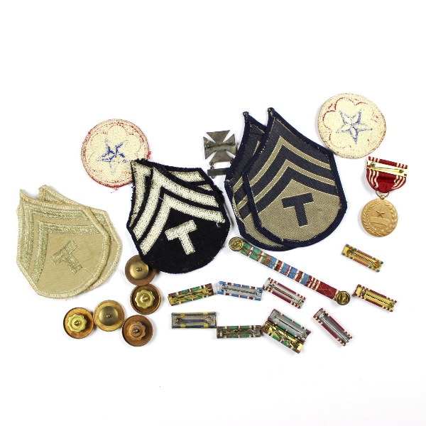Interesting grouping of insignia, dog tags, ID documents, photos,…